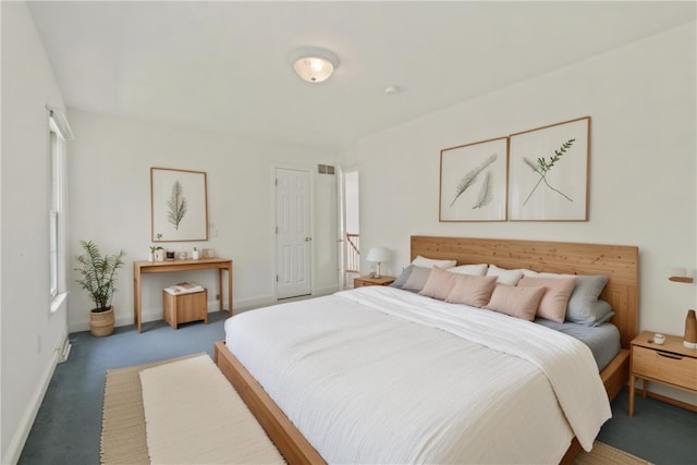 carpeted bedroom with baseboards