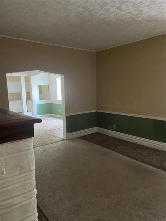 179 Washington St, Etna, PA 15223 - carpeted empty room featuring baseboards and ornamental molding
