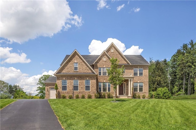 1765 Stevensan Dr, Franklin Park, PA 15143 - view of front facade featuring brick siding, a front lawn, asphalt driveway, and a garage