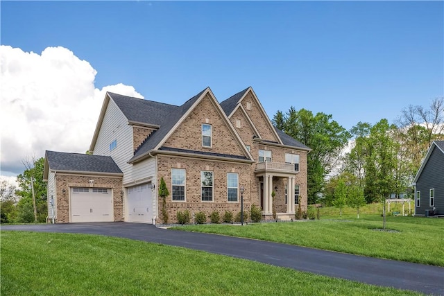 1765 Stevensan Dr, Franklin Park, PA 15143 - craftsman house with brick siding, driveway, a front lawn, an attached garage, and a balcony