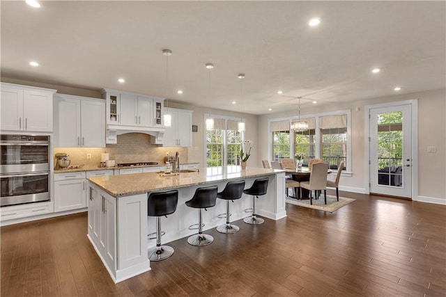 1765 Stevensan Dr, Franklin Park, PA 15143 - kitchen featuring stainless steel double oven, a sink, gas cooktop, recessed lighting, and white cabinets