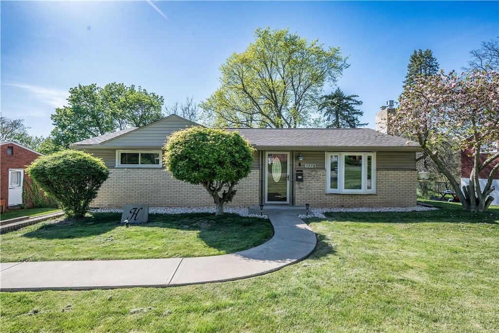 1570 Lucille Dr, Bethel Park, PA 15234 - ranch-style house featuring brick siding, a chimney, and a front yard