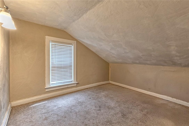 108 Pandora Dr, Derry Twp, PA 15627 - bonus room featuring lofted ceiling, carpet flooring, baseboards, and a textured ceiling