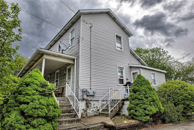 108 Pandora Dr, Derry Twp, PA 15627 - view of side of property featuring stairway and a porch