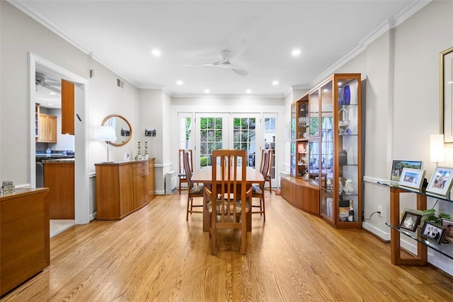 dining room with a ceiling fan, light wood-type flooring, ornamental molding, french doors, and recessed lighting