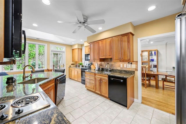 kitchen with black appliances, a sink, a ceiling fan, light tile patterned floors, and recessed lighting