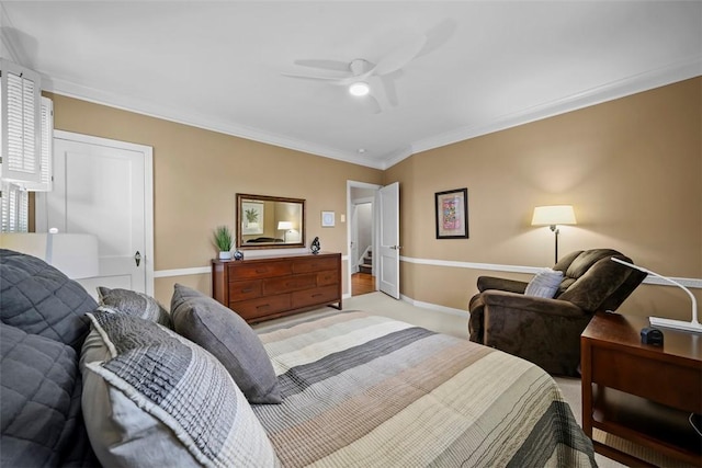 bedroom featuring crown molding, light colored carpet, ceiling fan, and baseboards