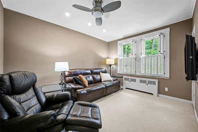 living area with radiator heating unit, ornamental molding, baseboards, recessed lighting, and a ceiling fan