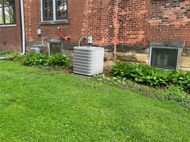 816 Main St, Brockway, PA 15824 - exterior view of central AC, brick siding, and gas meter