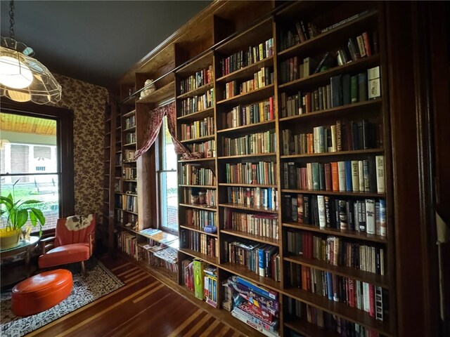 816 Main St, Brockway, PA 15824 - sitting room featuring bookshelves, wood finished floors, and wallpapered walls