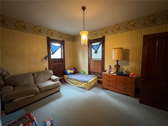carpeted bedroom with wallpapered walls