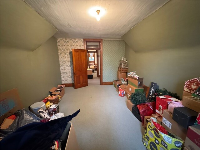 816 Main St, Brockway, PA 15824 - additional living space with vaulted ceiling, carpet floors, and wallpapered walls