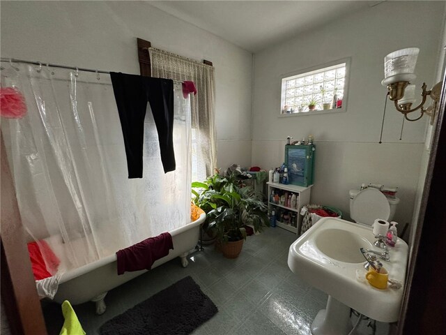 816 Main St, Brockway, PA 15824 - full bath featuring a freestanding bath, tile patterned floors, and a shower with shower curtain