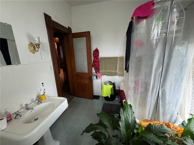 816 Main St, Brockway, PA 15824 - bathroom with tile patterned floors, tile walls, and wainscoting