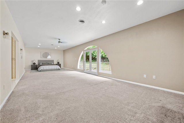 unfurnished bedroom featuring carpet, recessed lighting, and baseboards
