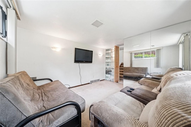 living room with carpet floors and baseboards