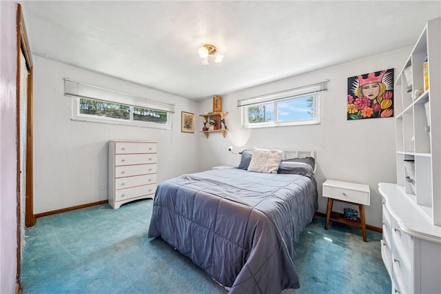 bedroom featuring carpet and baseboards