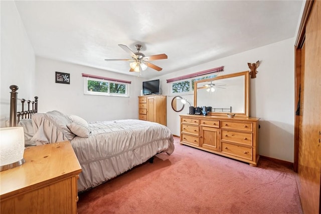 carpeted bedroom featuring a ceiling fan