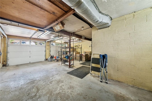 garage featuring concrete block wall