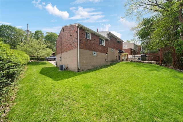back of property featuring brick siding