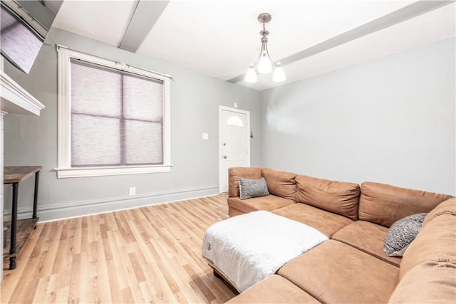 living area featuring wood finished floors and baseboards