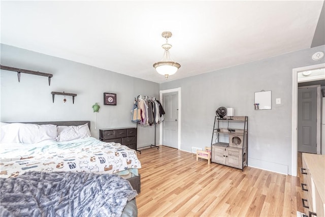 bedroom with light wood finished floors