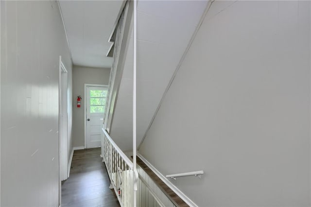 hall featuring wood finished floors and baseboards