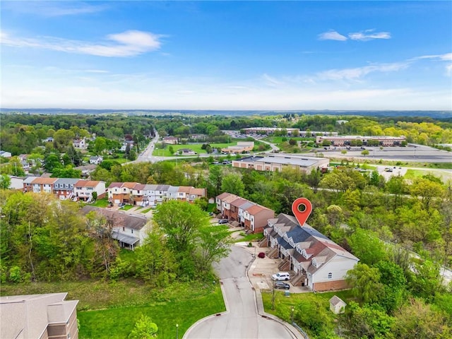 aerial perspective of suburban area with a tree filled landscape