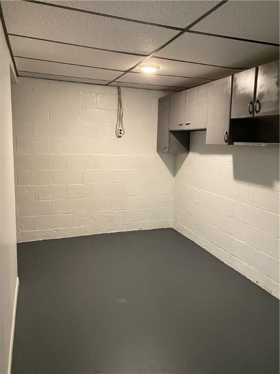 finished below grade area with a drop ceiling