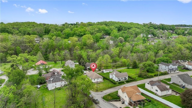 aerial view of residential area with a forest
