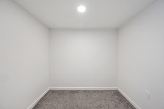 carpeted empty room featuring baseboards and recessed lighting