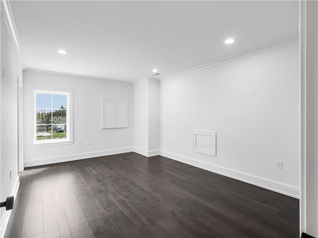 empty room with dark wood finished floors, ornamental molding, baseboards, and recessed lighting