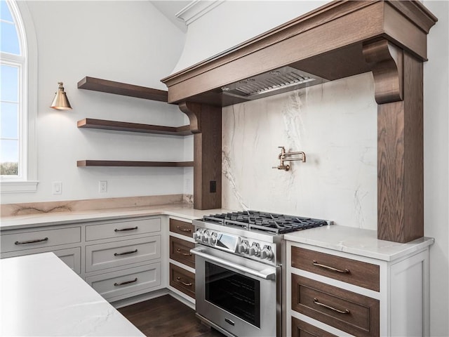 kitchen with high end range, custom range hood, plenty of natural light, and open shelves