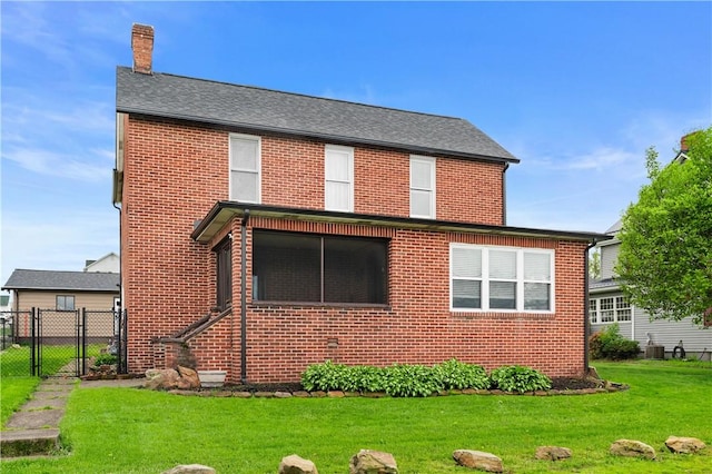 206 Constitution St, Perryopolis, PA 15473 - back of house featuring a chimney, brick siding, and a gate