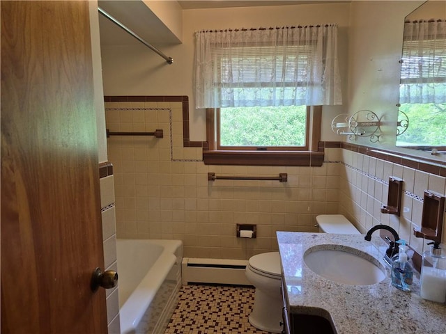 bathroom featuring a baseboard radiator, plenty of natural light, toilet, tile walls, and a wainscoted wall