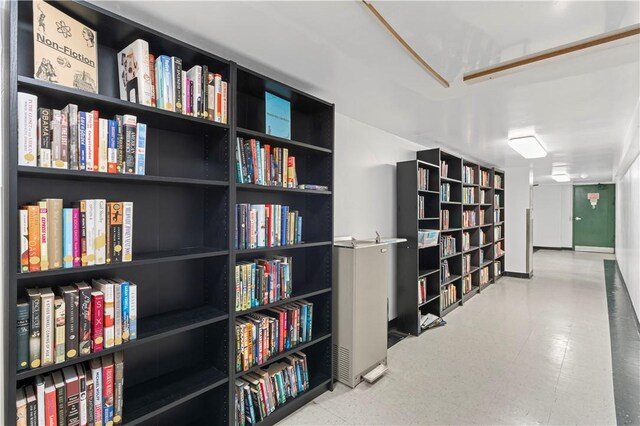 unfurnished room featuring tile patterned floors and baseboards