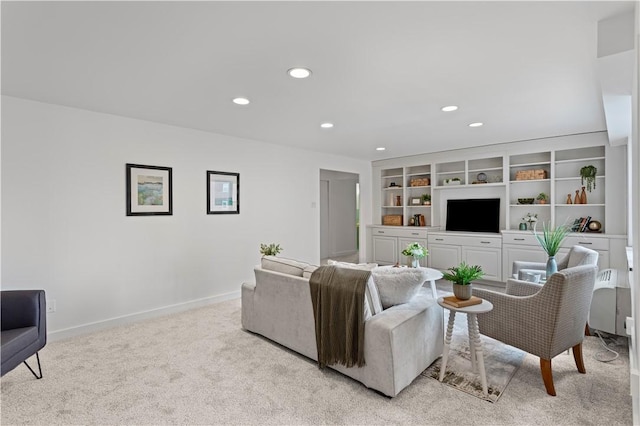 living room with light carpet, recessed lighting, and baseboards
