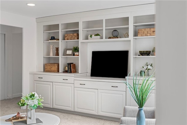living area with light carpet and recessed lighting