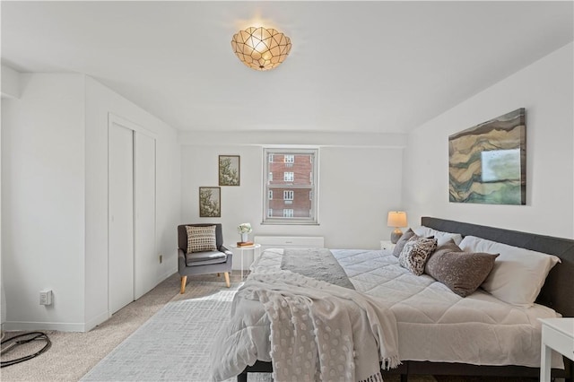 bedroom featuring carpet flooring and baseboards