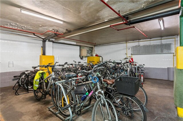 garage featuring concrete block wall and bike storage