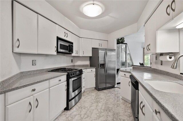 402 Forest Edge Ct, Mccandless, PA 15090 - kitchen with appliances with stainless steel finishes, a sink, light marble finish floors, and white cabinets