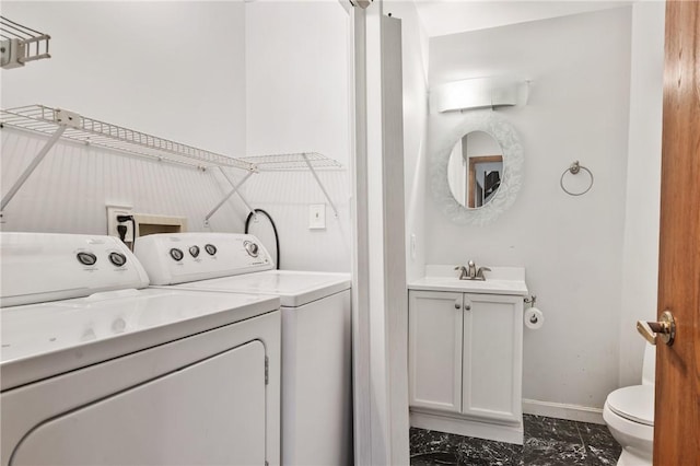 402 Forest Edge Ct, Mccandless, PA 15090 - laundry area with dark marble finish flooring, washer and clothes dryer, and baseboards