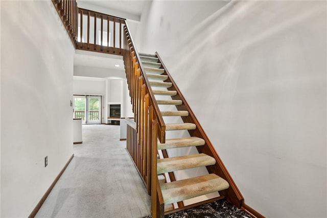 402 Forest Edge Ct, Mccandless, PA 15090 - stairway featuring baseboards and a high ceiling