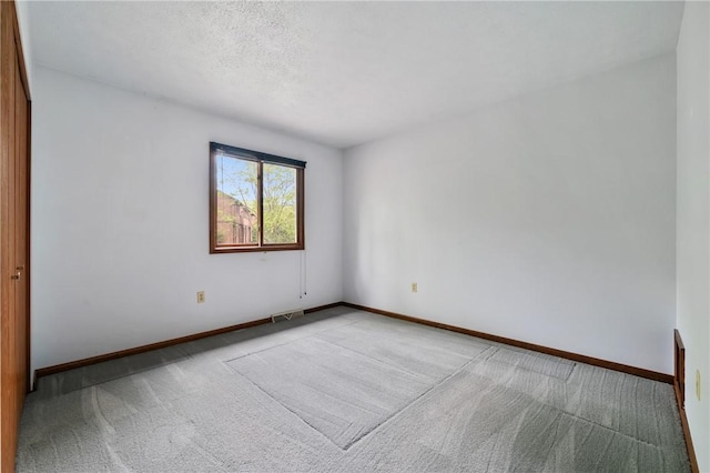 402 Forest Edge Ct, Mccandless, PA 15090 - empty room featuring carpet flooring, baseboards, and a textured ceiling