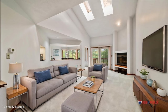 402 Forest Edge Ct, Mccandless, PA 15090 - living area featuring light carpet, a skylight, high vaulted ceiling, and a fireplace