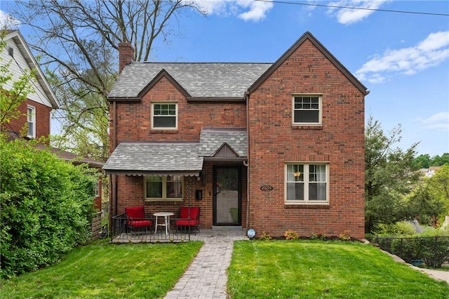 3234 Shadyway Dr, Brentwood, PA 15227 - view of front of home featuring brick siding, a front yard, a chimney, and a shingled roof