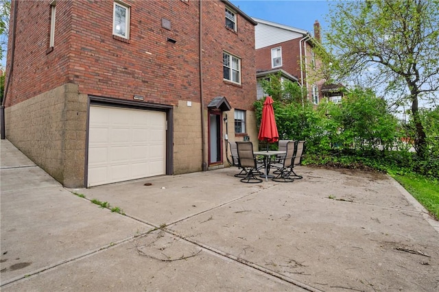 3234 Shadyway Dr, Brentwood, PA 15227 - view of home's exterior with an attached garage, brick siding, and driveway