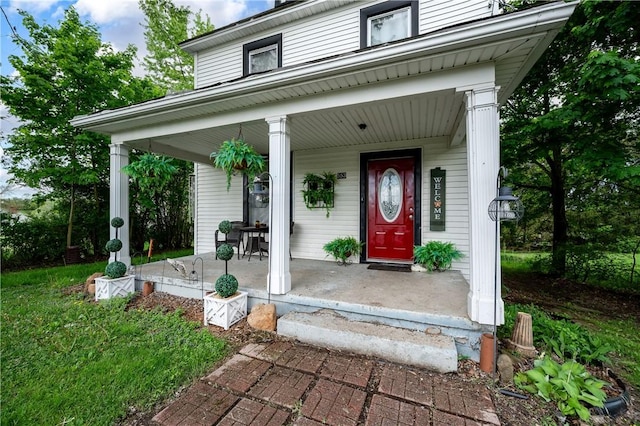 property entrance featuring a porch