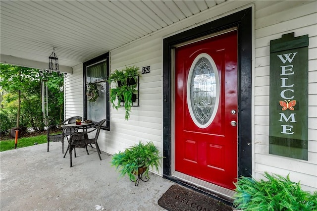 doorway to property featuring covered porch