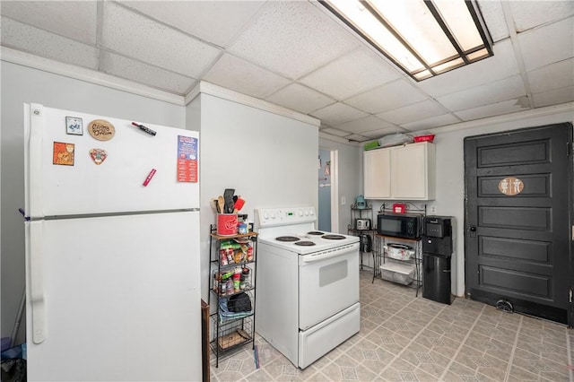 kitchen featuring white appliances, a paneled ceiling, white cabinets, light countertops, and light tile patterned flooring